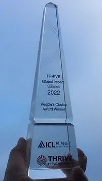 The THRIVE Global Impact Summit 2022 People's Choice Award trophy