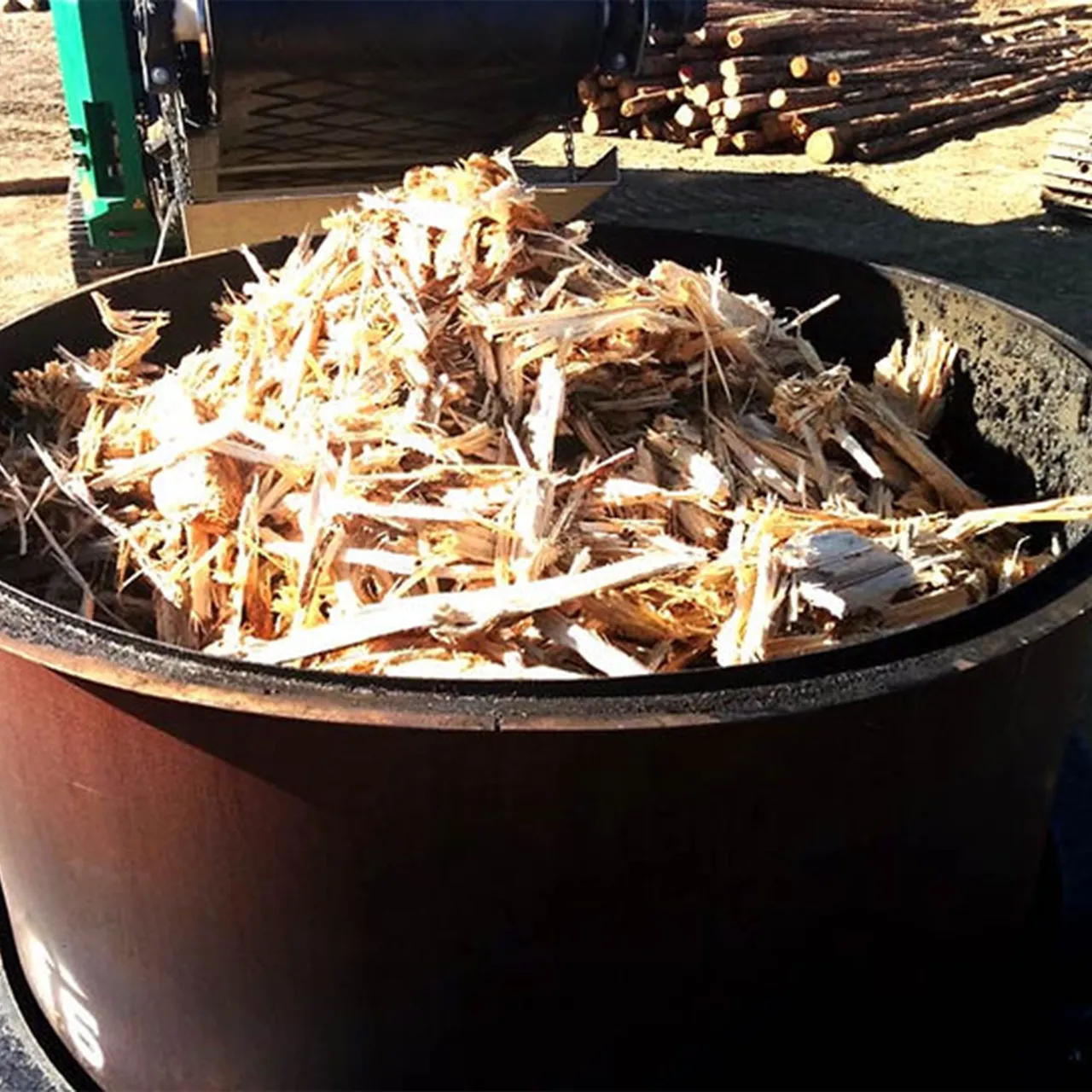 Waste wood feedstock loaded in a kiln